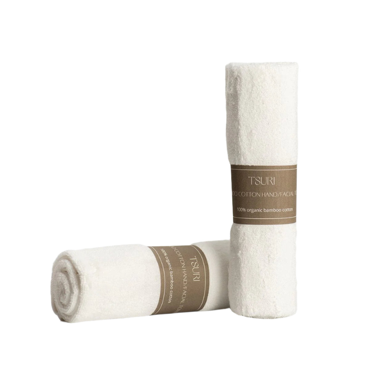 Two rolled bamboo cotton hand towels with labels, showcasing their ultra-soft and antibacterial qualities for sensitive skin and daily use.