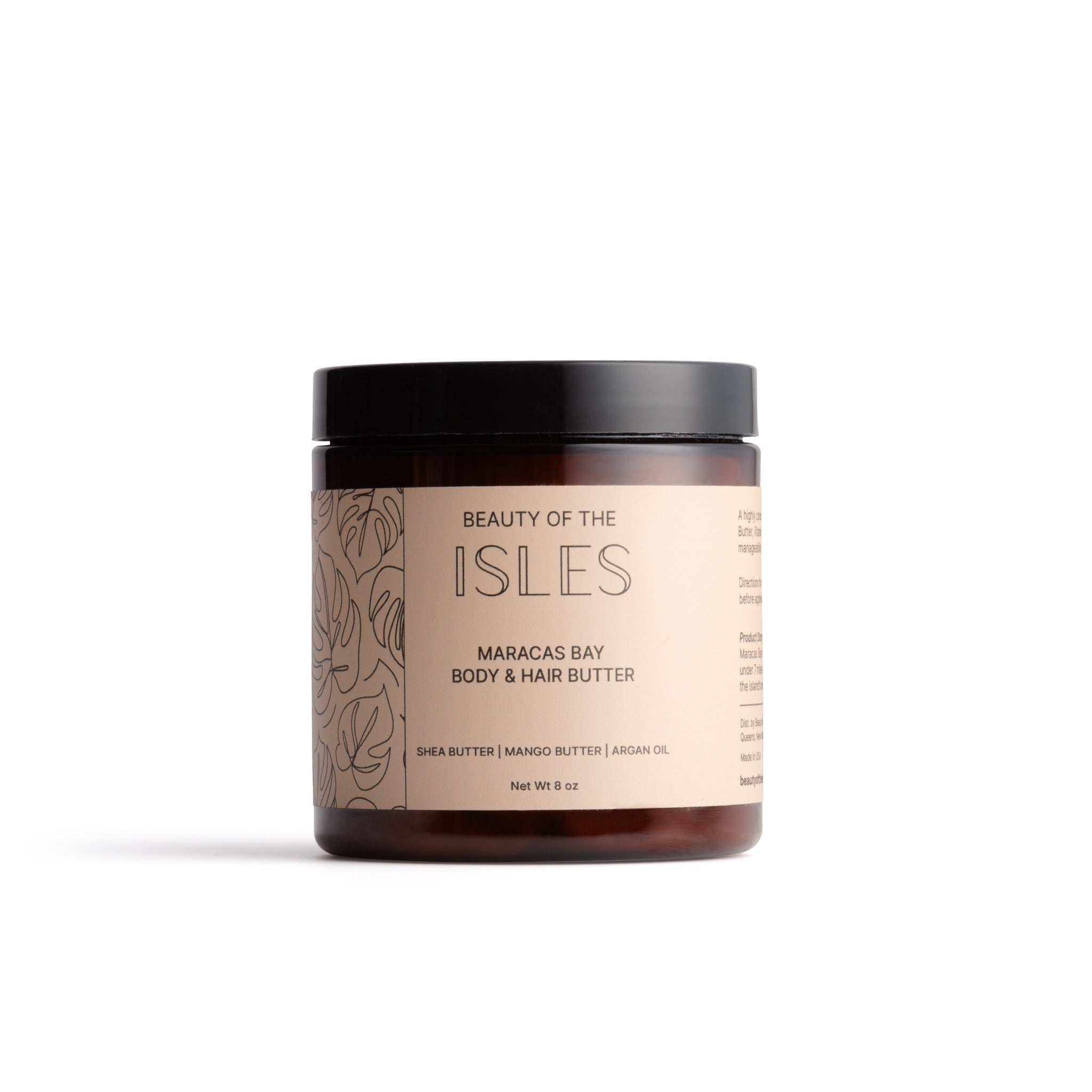 Beauty of the Isles Maracas Bay Body & Hair Butter jar with shea, mango butter, vitamin E, and argan oil for nourishing skin and hair.