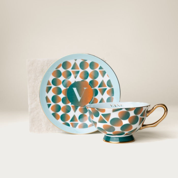 Monogram tea set featuring 8oz bone China cup and saucer with Gullah Geechee inspired design, ideal for rituals and display.