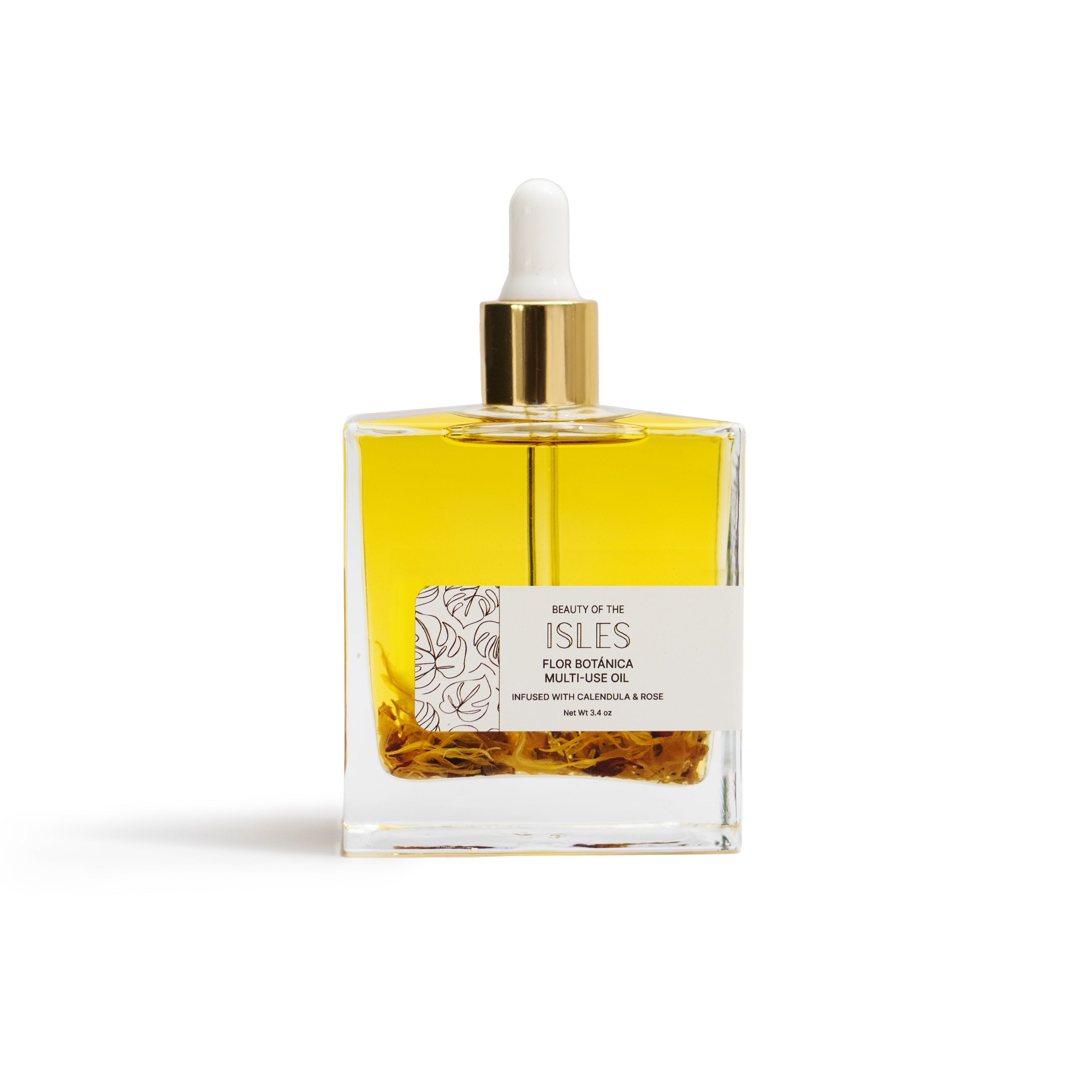 Flor Botánica Multi-Use Oil in a glass bottle, enriched with calendula and rose, rooted in Caribbean bush medicine for skin and hair care.