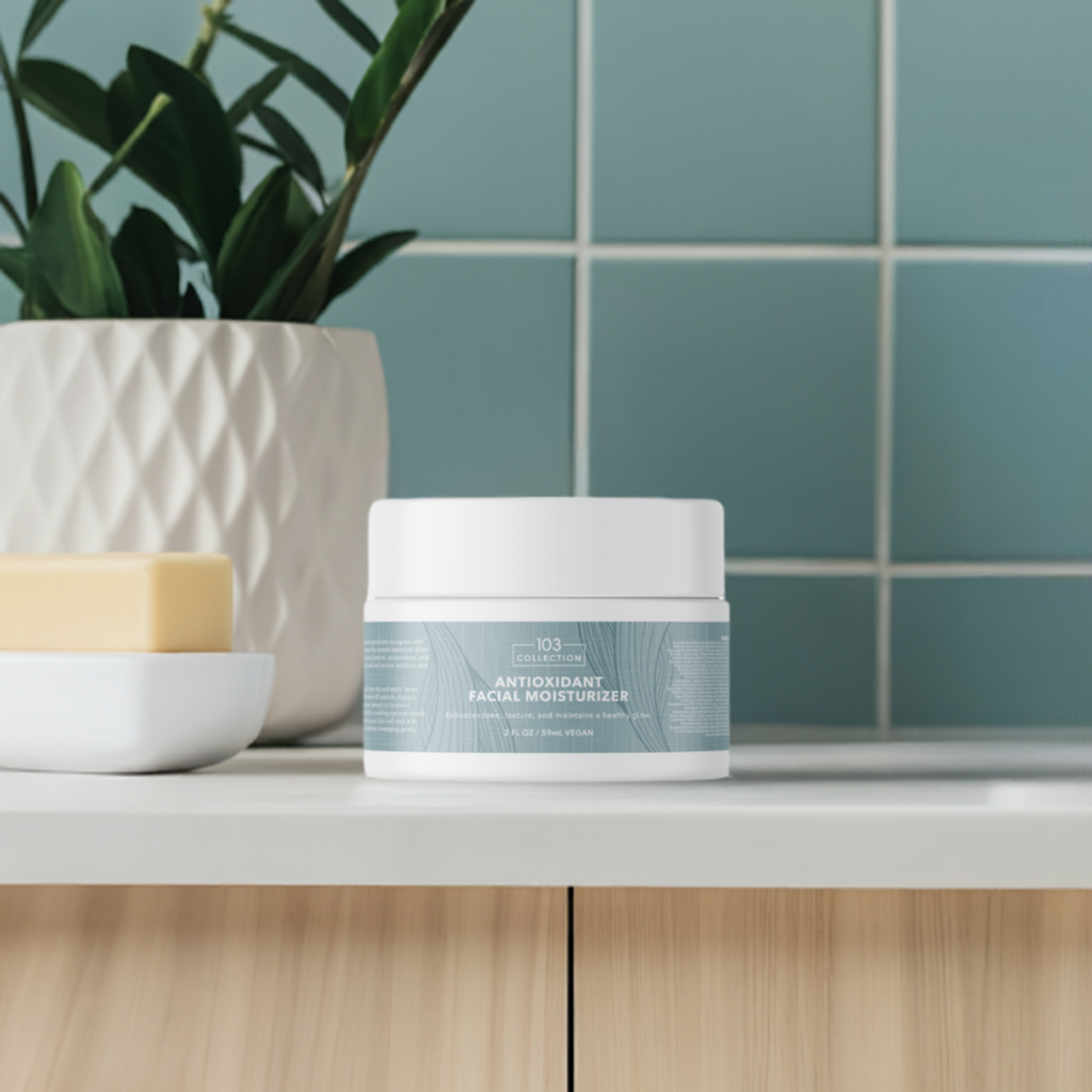 Vegan Antioxidant Facial Moisturizer jar on bathroom counter, surrounded by plant and soap for hydration and skin rejuvenation