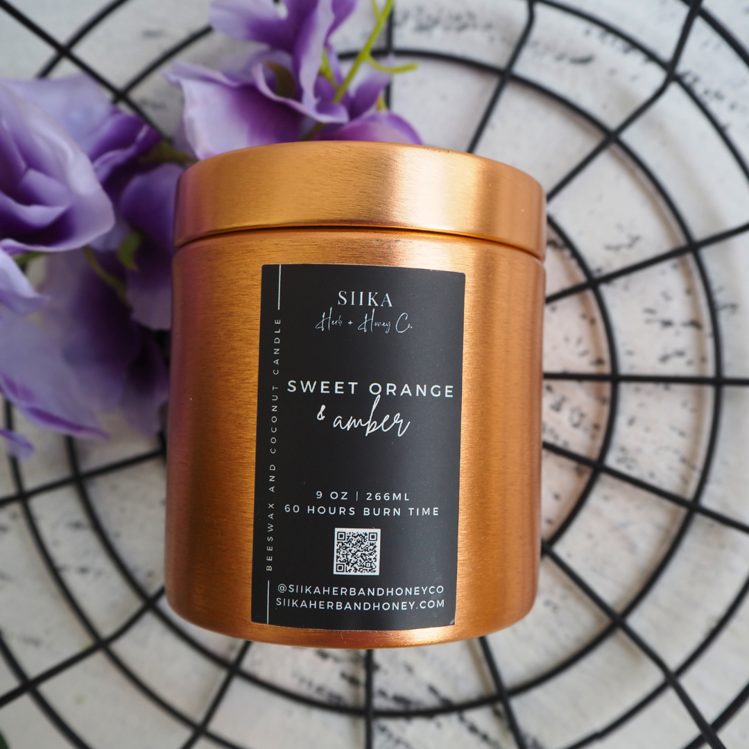 SIIKA Sweet Orange & Amber beeswax candle in copper tin with purple flowers, 9 oz, 60-hour burn time, elegant home decor