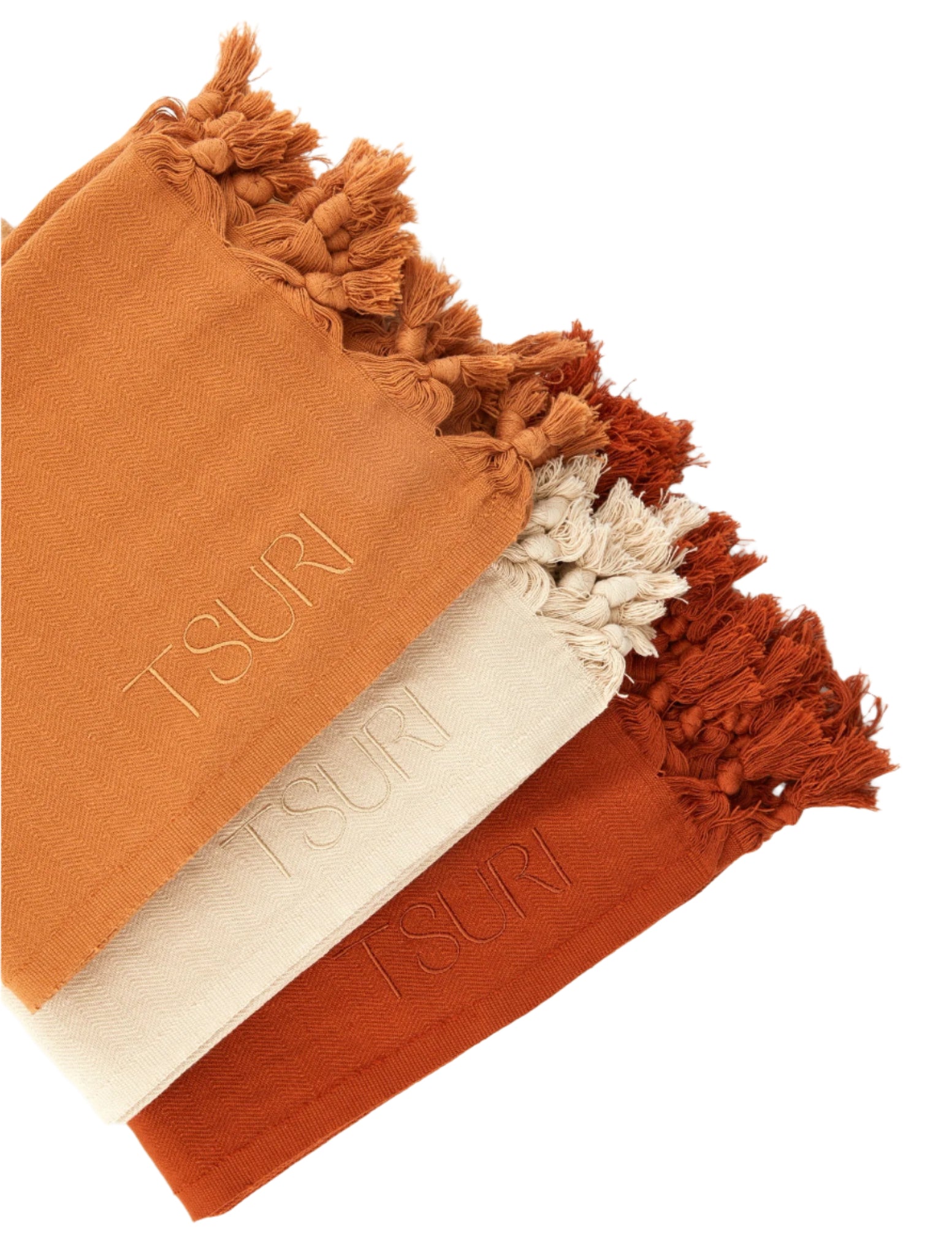 Three folded Hagia Sofia bath sheets in warm architectural hues with tassel details, inspired by Istanbul’s timeless beauty.