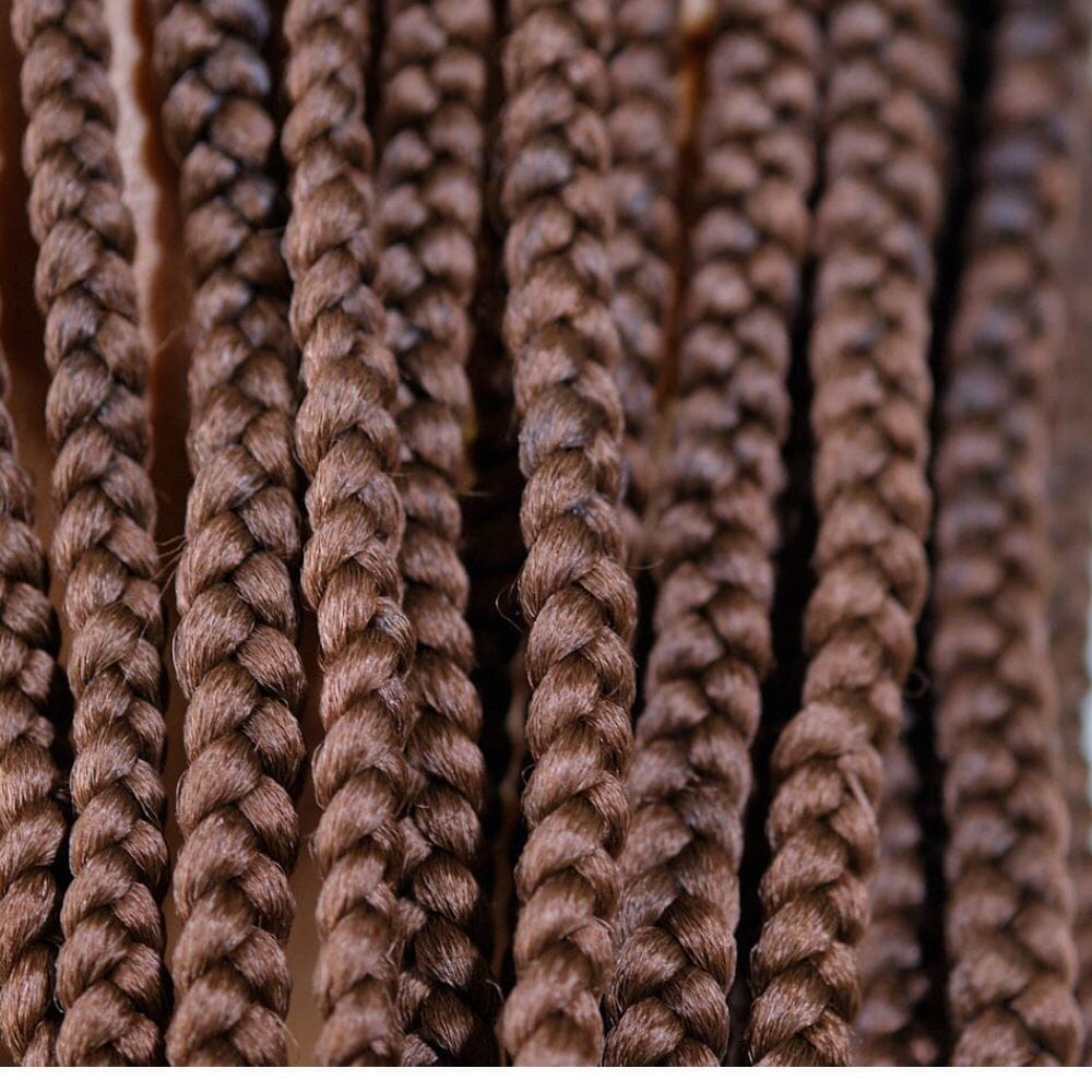 28-inch hypoallergenic braiding hair in a close-up view, showcasing pre-stretched, natural, lightweight, and comfortable fibers.