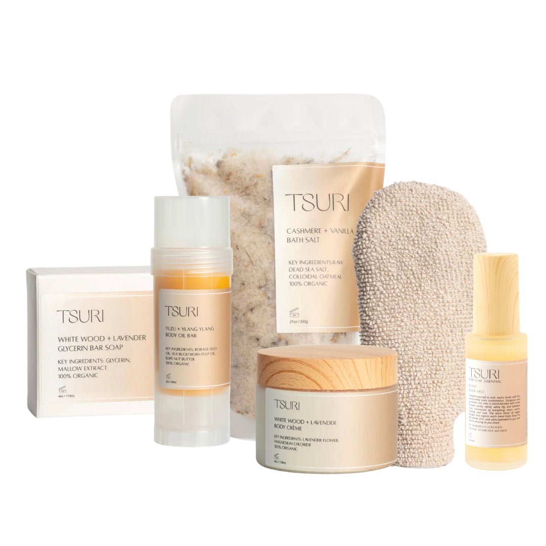 Tsuri Refresh Ritual Kit with body care essentials, including exfoliating glove, bath salts, soap, cream, and oils for glowing skin.