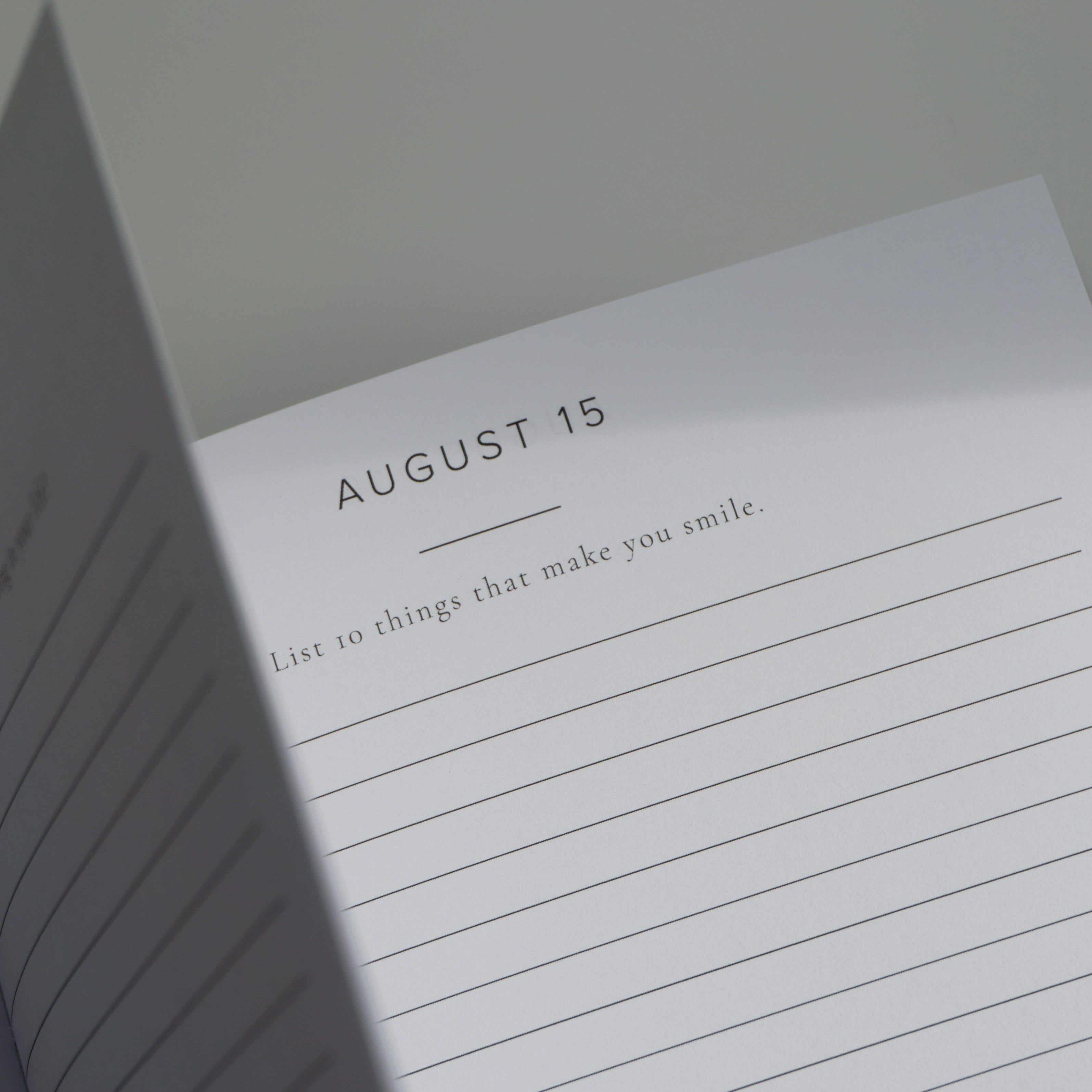 Open page of Better Every Day Journal showing prompt for August 15: List 10 things that make you smile. Daily guided journaling.