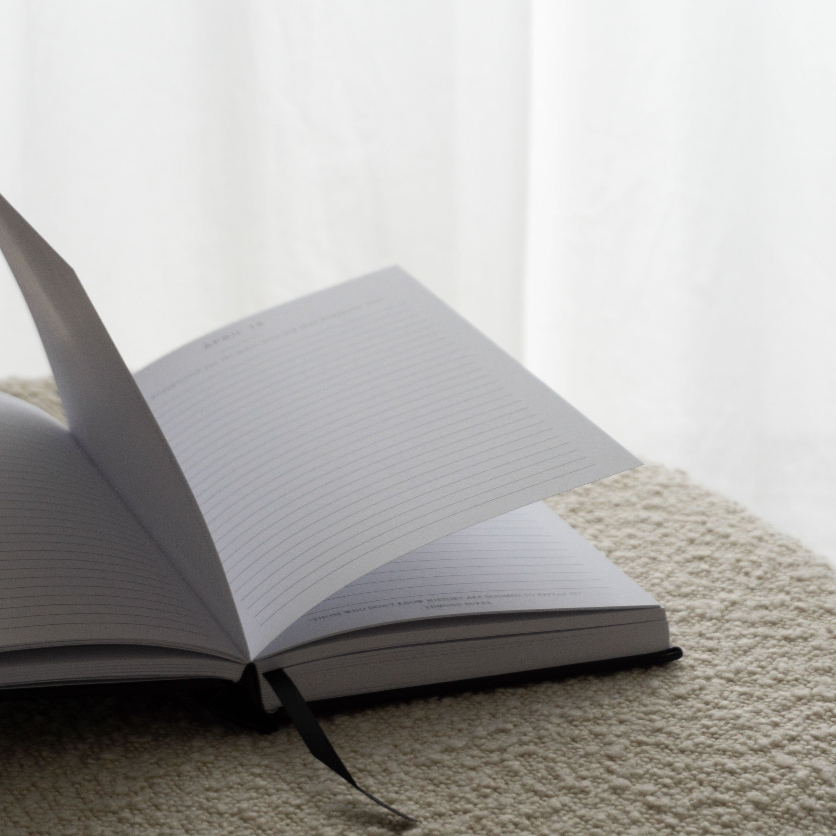 Open Better Every Day Journal with lined pages, designed for daily reflection and self-care, resting on a textured surface.