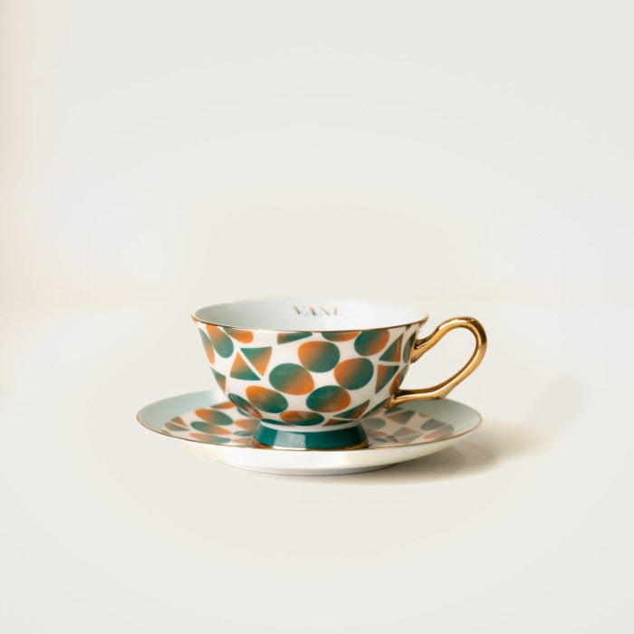 Monogram Tea Set with bold Gullah Geechee art design, showcasing a refined 8oz bone China cup and saucer for an elegant tea ritual.