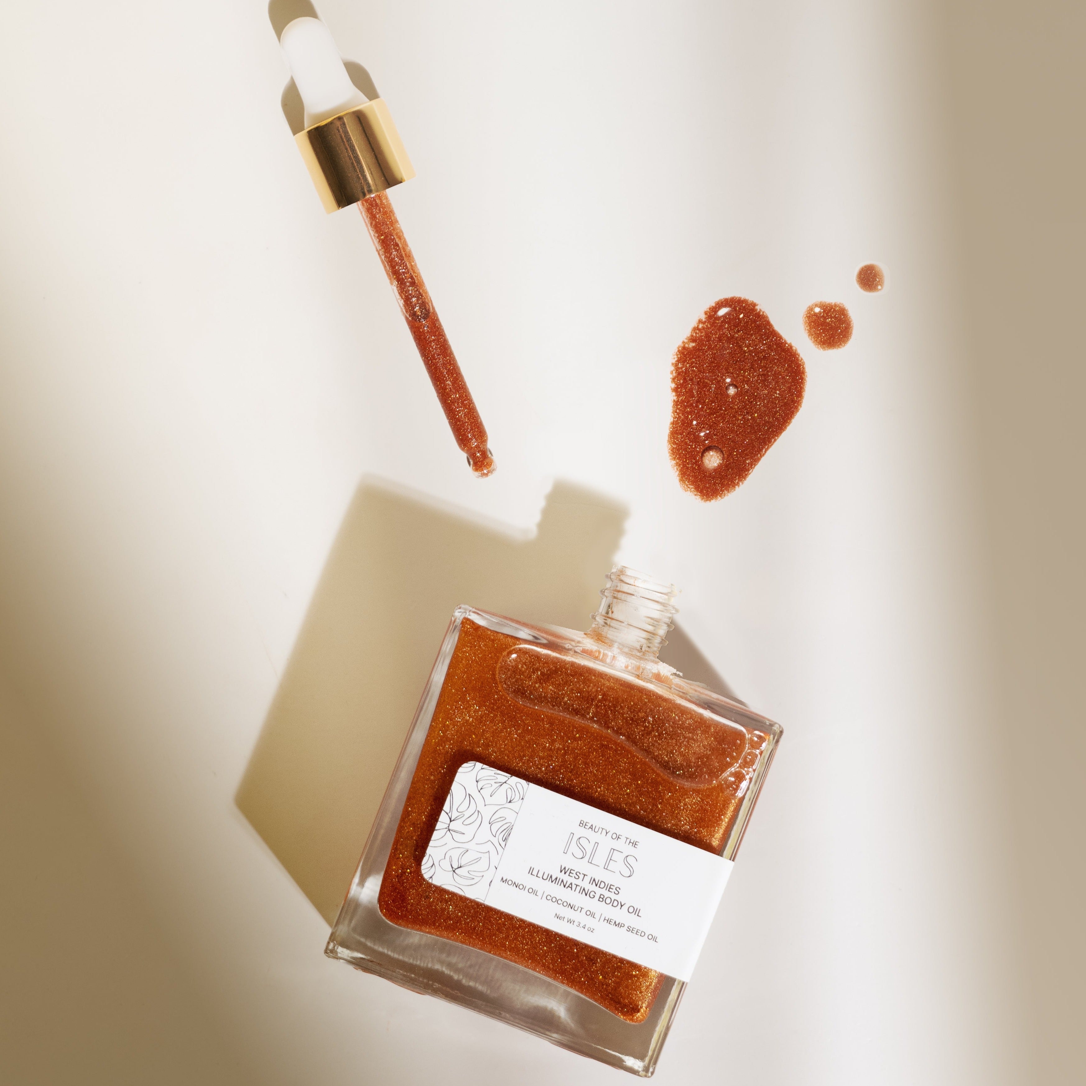 West Indies Illuminating Body Oil with radiant shimmer for hydrated, glowing skin, inspired by Caribbean beauty.